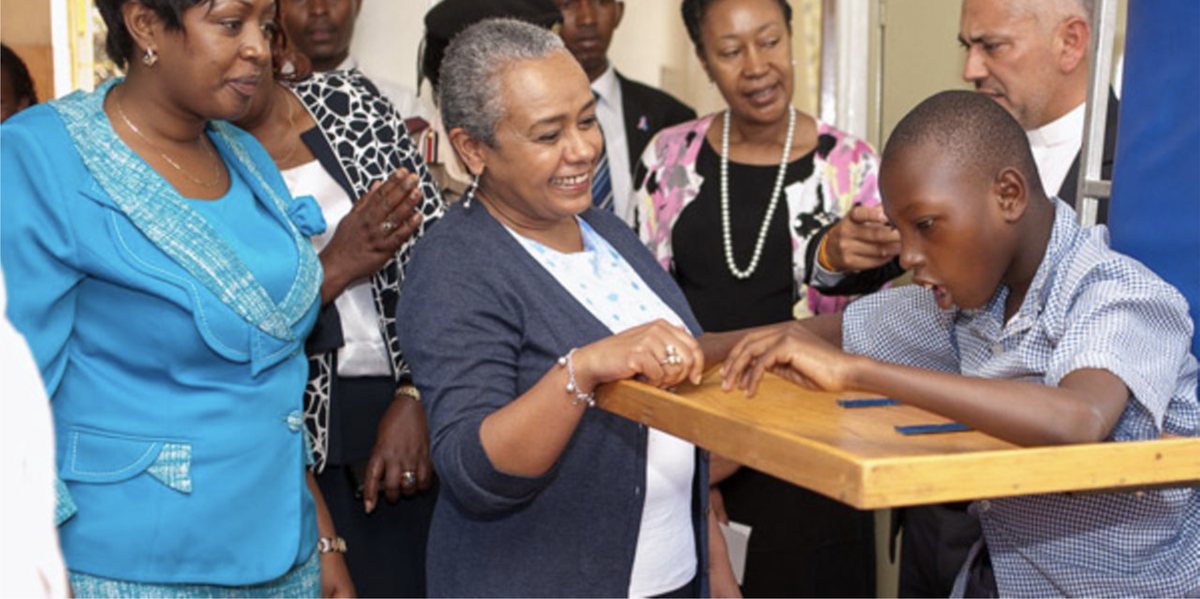 First Lady Margaret Kenyatta visiting a child at the centre